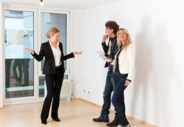 Real estate market - young couple looking for real estate to rent or buy an apartment