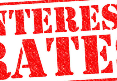 INTEREST RATES red Rubber Stamp over a white background.